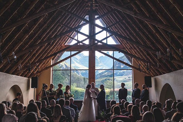 Couple getting married inside Cathedral Peak Hotel chapel