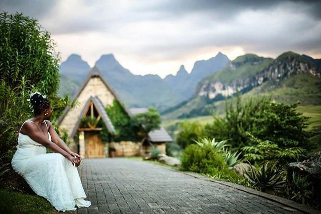 Bride with Cathedral Peak Hotel chapel in the background