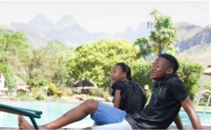 Couple relaxing by the pool